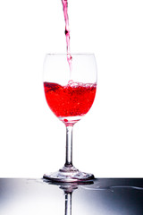 glass and red liquid isolated on white background.