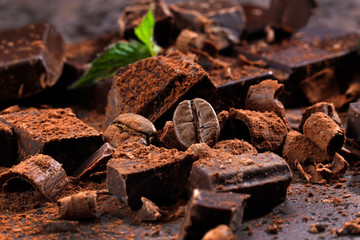 Dark chocolate and coffee bean on a stone table 
