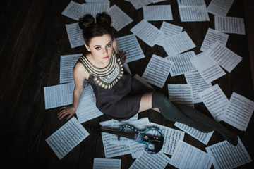 girl posing and holding a violin