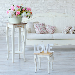 Interior with vintage furniture elements, love letters and decorative flowers