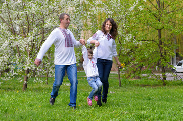 Naklejka na ściany i meble happy Ukrainian family father mother and daughter