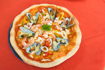 delicious hot seafood pizza from oven