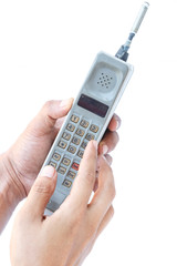 man hand holding vintage mobile phone Isolated on white background.