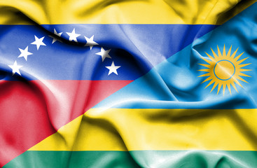 Waving flag of Rwanda and Venezuela