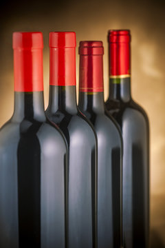 Red wine bottles stacked vertically