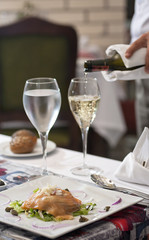 Salmon with served white wine