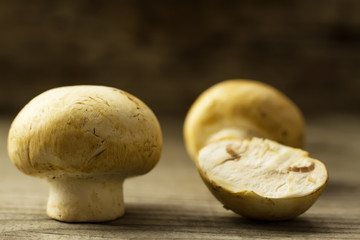 fresh mushrooms on wooden background, close-up
