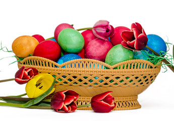 Colored easter eggs placed in a basket