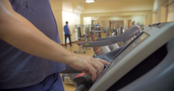 Man finishing his workout on treadmill