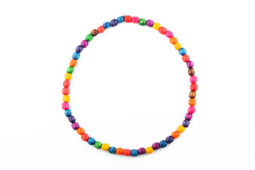 Colorful handmade wooden painted beads necklace isolated on whit