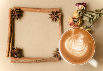 a cup of latte art on brow background, vintage coffee