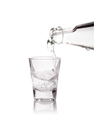 Glass of vodka isolated on white