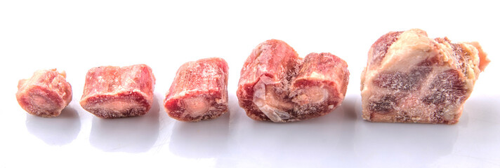 Raw frozen ox tail on white background