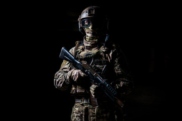Fototapeta na wymiar Soldier in camouflage hold machine gun