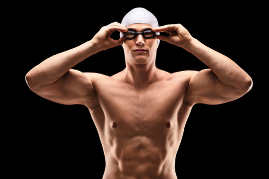 Young male swimmer with black swimming goggles