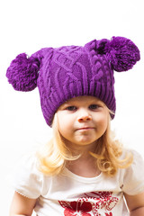 Nice little girl in knitted hat 