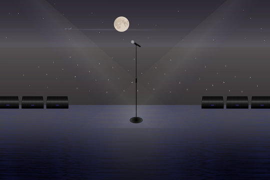 A microphone on a stage in the open air.