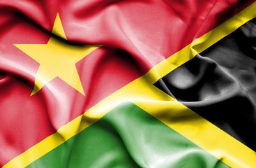 Waving flag of Jamaica and Vietnam