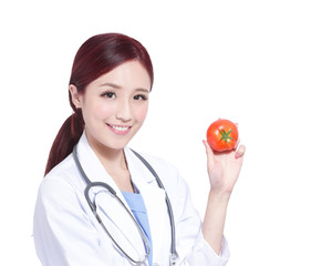 Smile woman doctor hold tomato