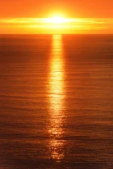 Raamstickers Sunrise reflected on the ocean © Smileus