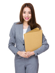 Businesswoman holding with folder