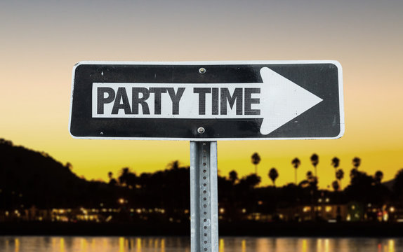 Party Time direction sign with sunset background