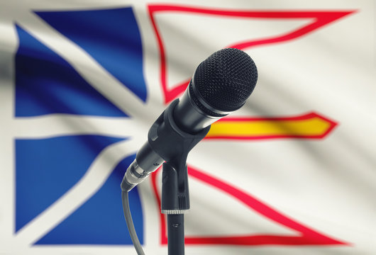 Microphone on stand with Canadian province flag on background - Newfoundland and Labrador