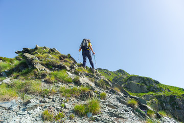 Mountain climbing on steep rocky slope