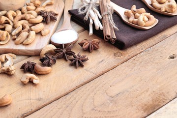 Roasted cashews nuts with natural on wood background