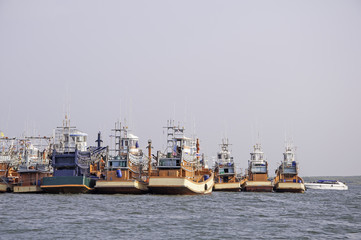 Fototapeta premium Fishing boats at the harbor in Thailand