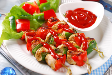 chicken and vegetable grilled skewers with ketchup