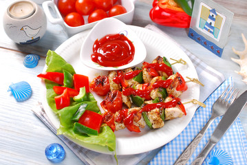 chicken and vegetable grilled skewers with ketchup