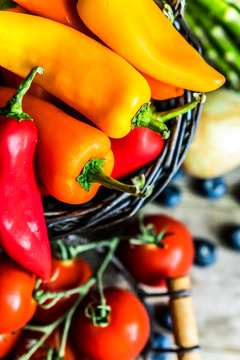 Colorful vegetables on wooden background