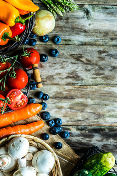 Colorful vegetables on wooden background