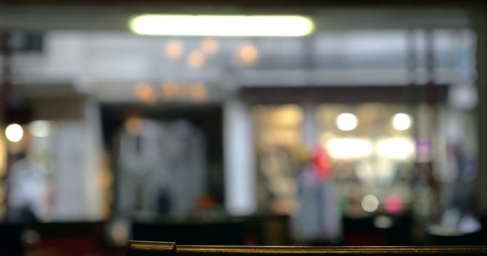 Defocused view of city street through the cafe window