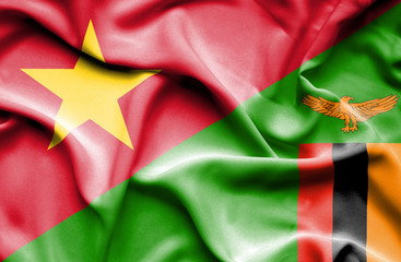 Waving flag of Zimbabwe and Vietnam