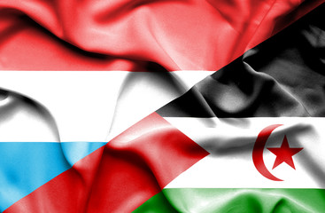 Waving flag of Western Sahara and Luxembourg