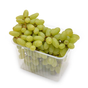 White grapes in the package isolated on white.