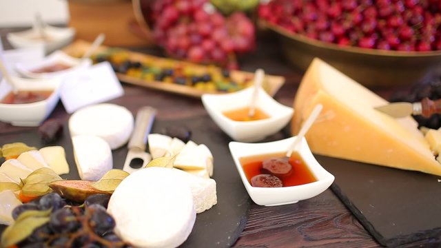 set of ingredients: cheese, olives, berries, sauces, snacks