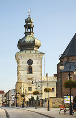 Clock tower on Pilsudski street in Krosno. Poland - obrazy, fototapety, plakaty