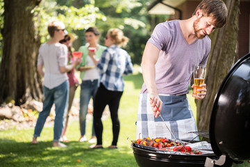 Young man doing barbecue