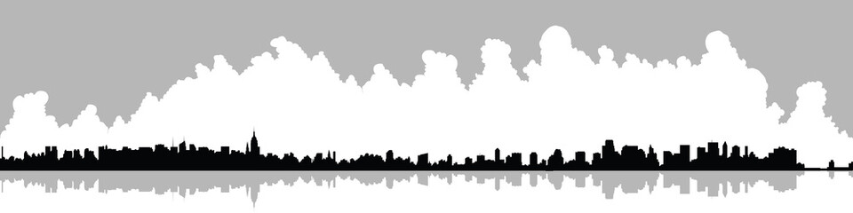 Long skyline silhouette of Manhattan skyscrapers in New York City.