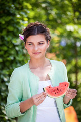 Beauty woman eating watermelon