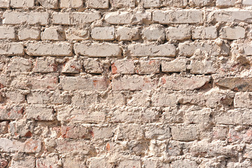 abstract background from a damaged brick and masonry
