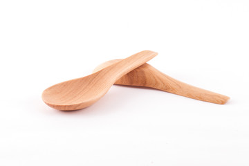 Wooden spoons isolated on white background.