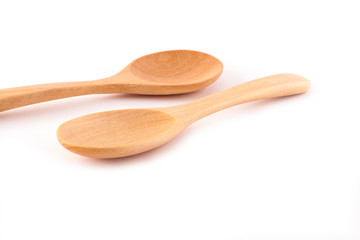 Wooden spoons isolated on white background.