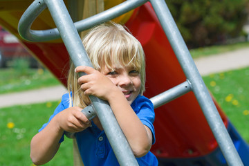Little boy having fun on the playground