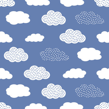 Seamless pattern with white clouds on blue background.