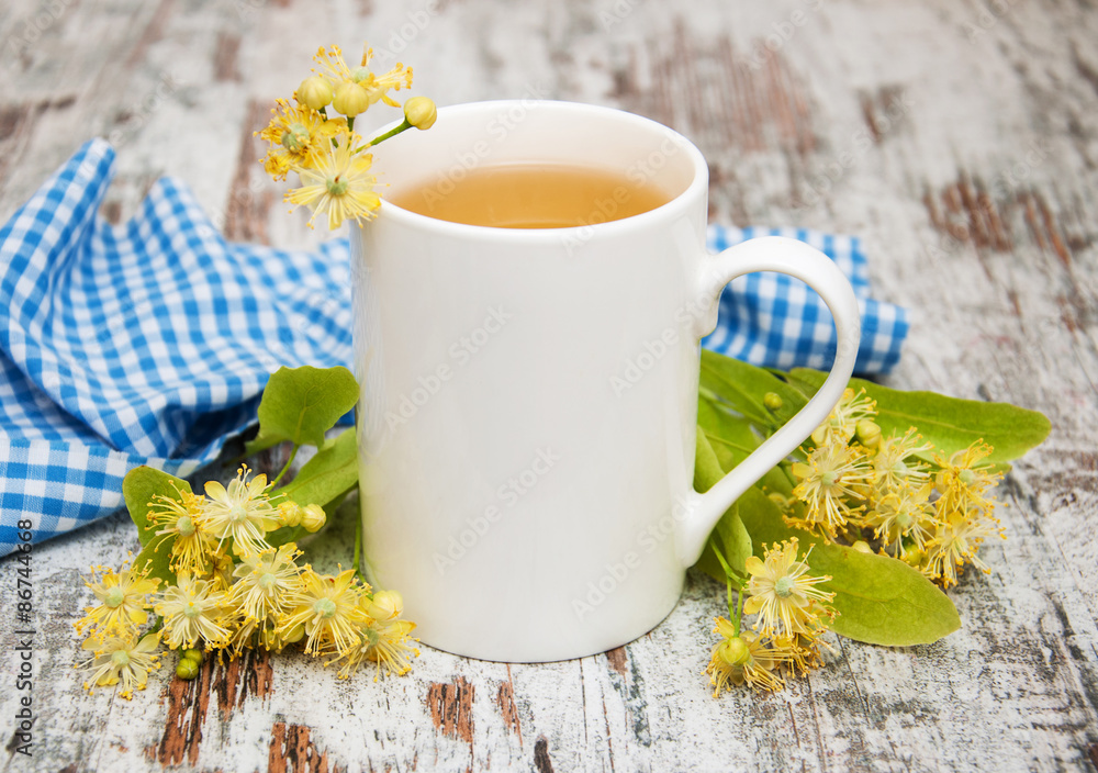 Poster Cup of herbal tea with linden flowers