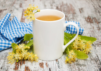 Cup of herbal tea with linden flowers